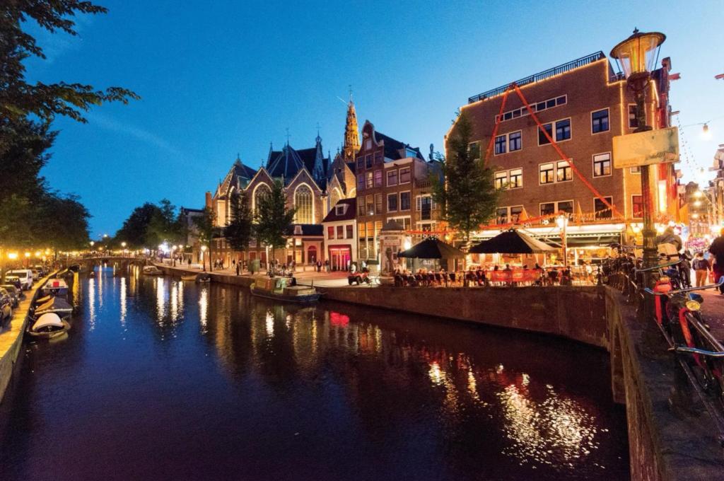 A view of the Oudezijds Voorburgwal canal in the De Wallen district of Amsterdam.