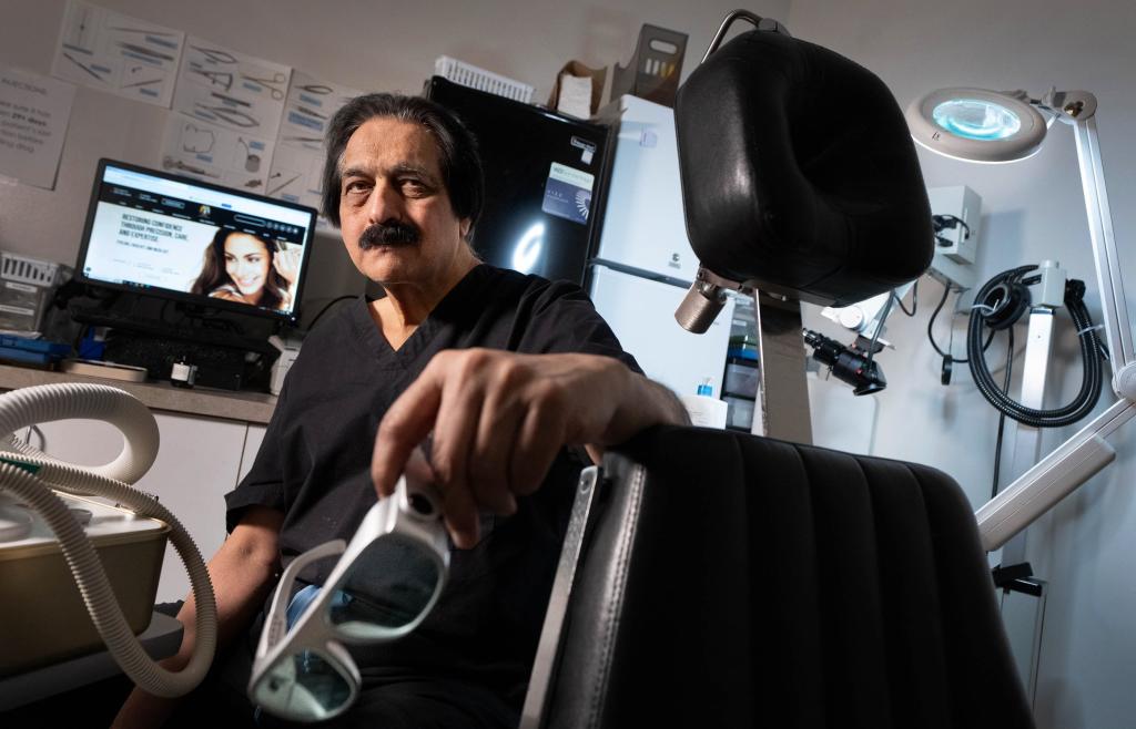 Dr. Bhupendra Patel, former head of facial plastic surgery at the University of Utah and now a facial surgeon in private practice, poses for a portrait in his Salt Lake City office.
