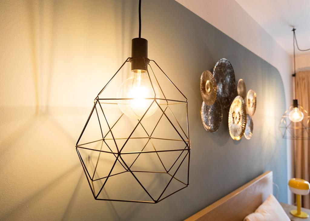 Modern industrial and geometric pendant light for indoor lighting.