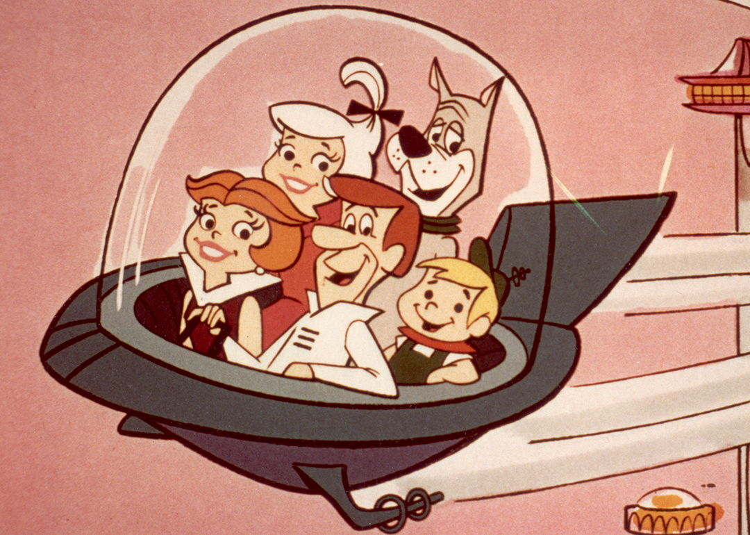 The Jetsons flying in a space car.