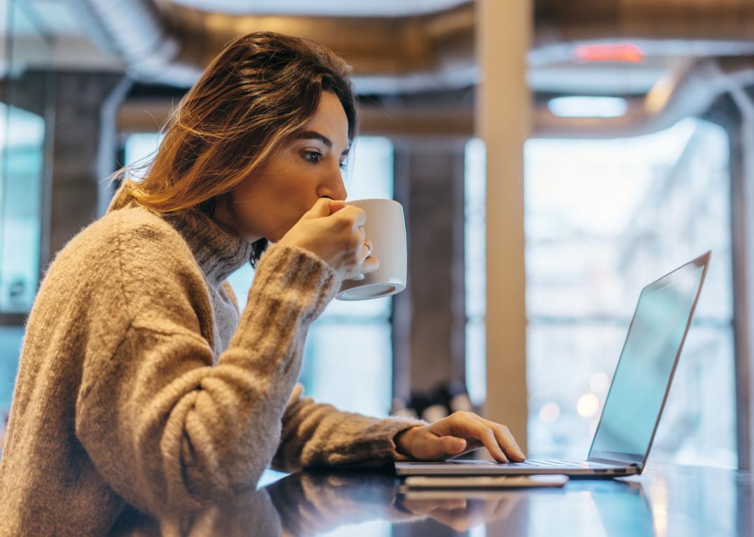 Person reading email on laptop.