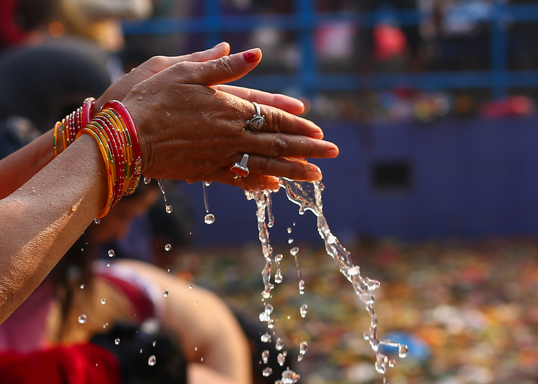 A Nepali Hindu offer prayers at Matatirthau.