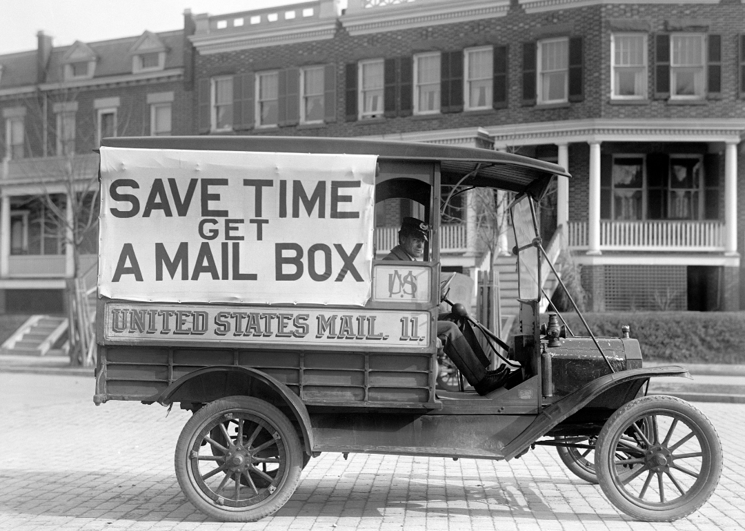 Mail wagon with “Save Time Get a Mail Box” sign