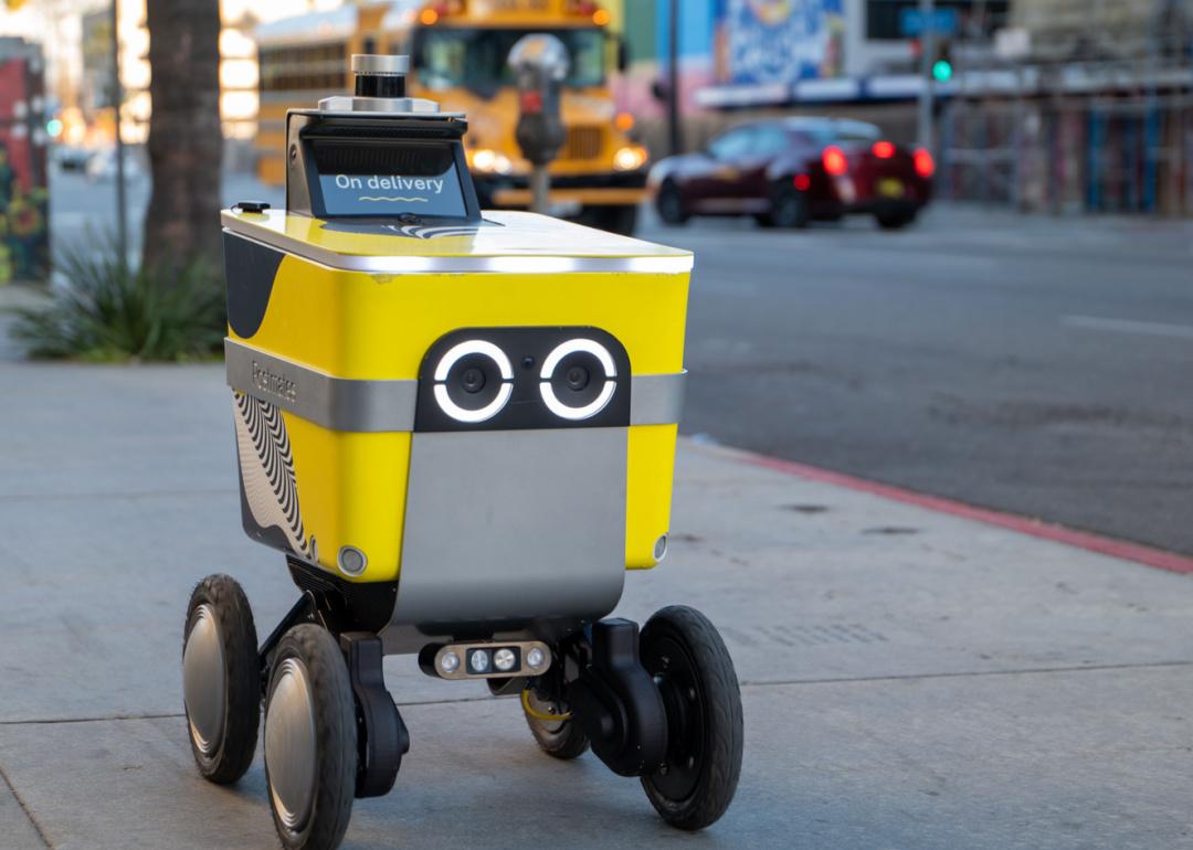Food delivery robot on city sidewalk.