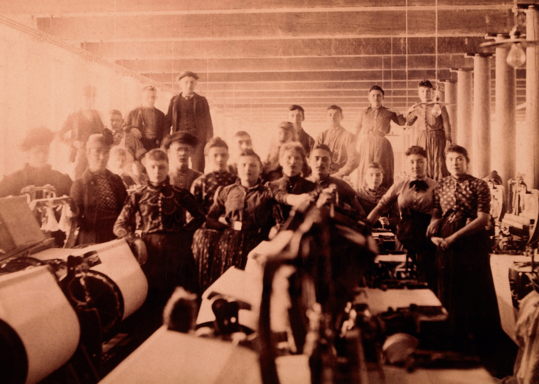 Group of mill workers seated for portrait