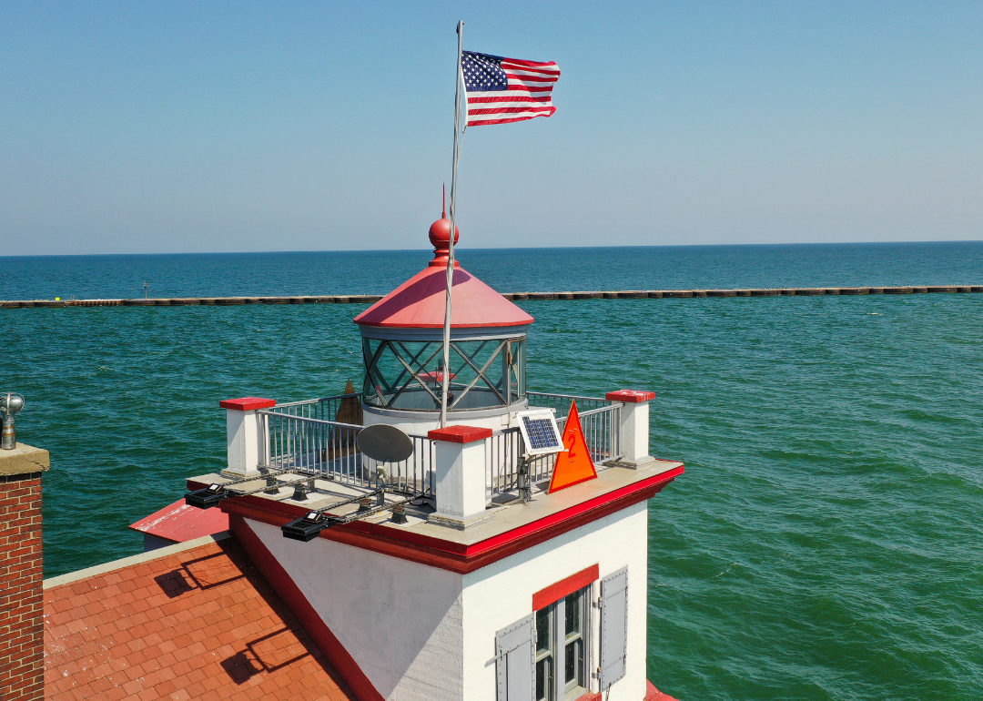 Boat motoring by Waukegan Lighthouse