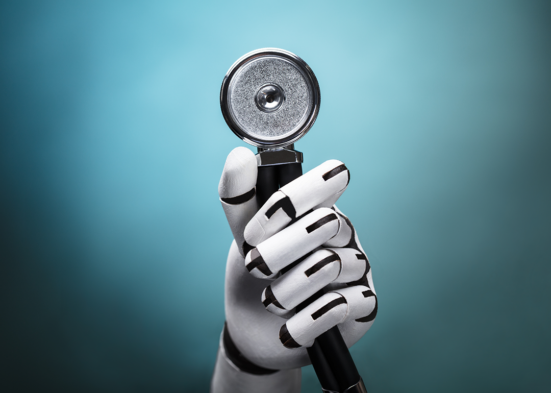 Close-up of a robot's hand holding stethoscope.