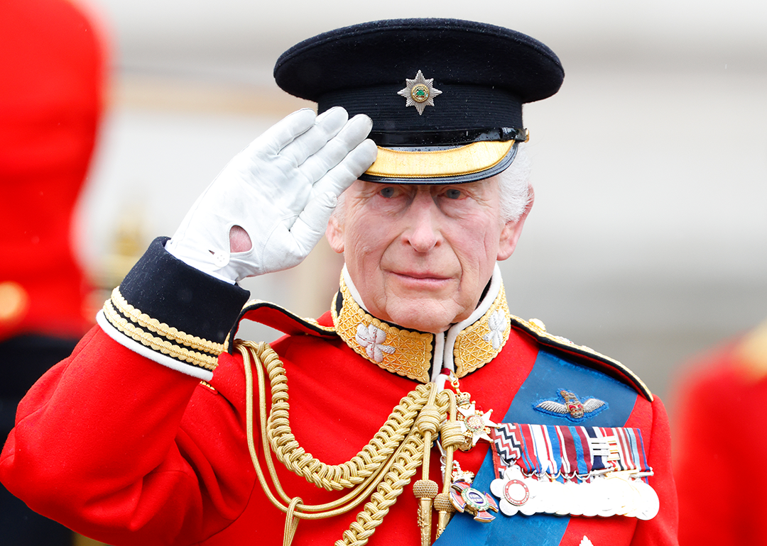 King Charles III takes the salute outside Buckingham Palace after Trooping the Colour.