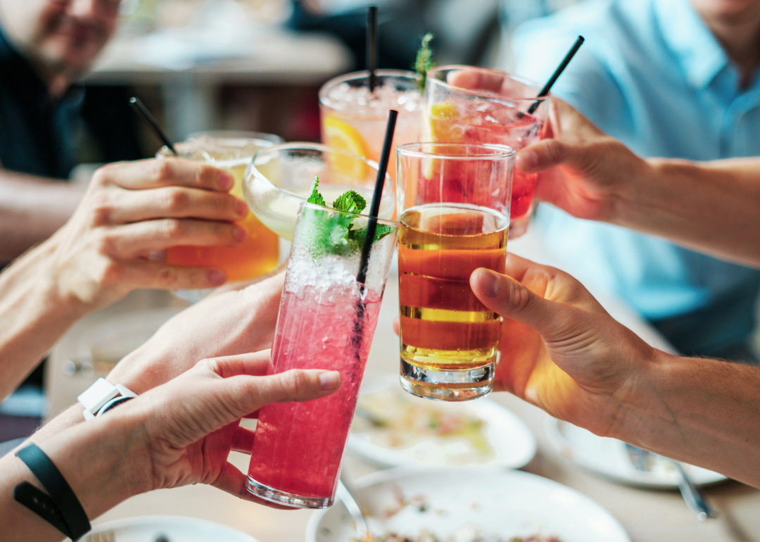 Friends toasting with drinks.