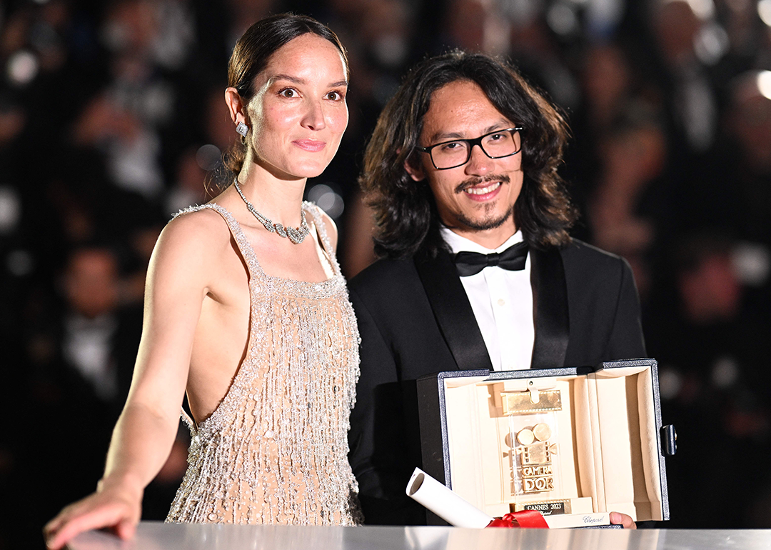 Pham Thien An poses with Anais Demoustier after he won the Camera d'Or at the Cannes Film Festival.