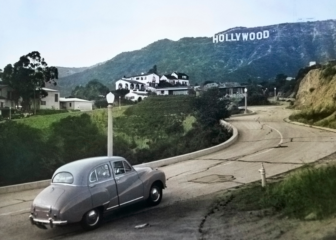 Car driving up through Hollywood hills