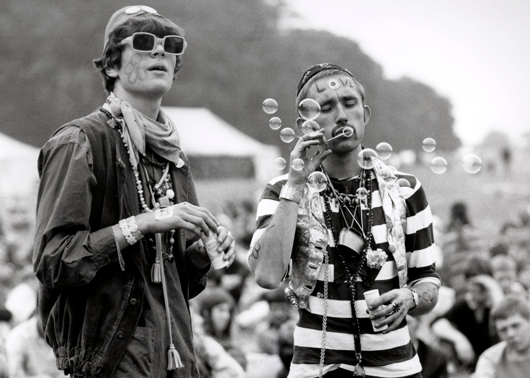 Two festivalgoers blowing bubbles.