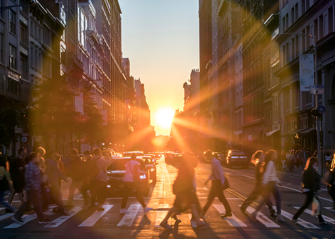 Sun setting between buildings in midtown Manhattan.