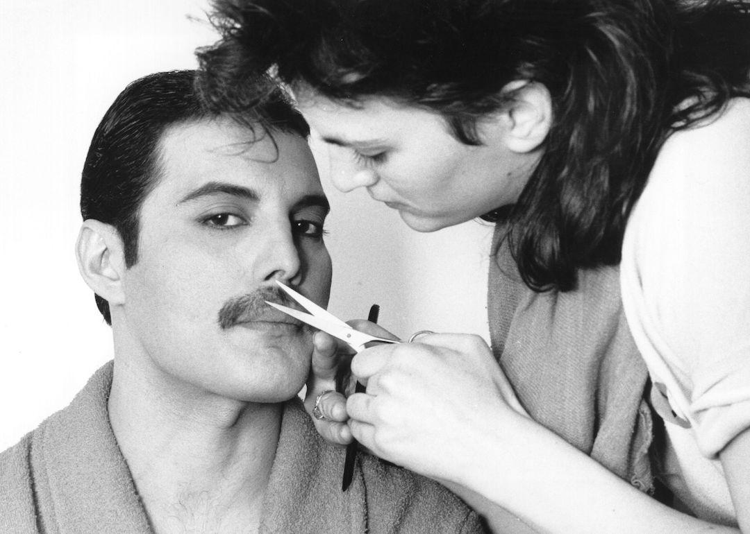 Rock singer Freddie Mercury of the popular British group Queen has his mustache groomed in 1982.