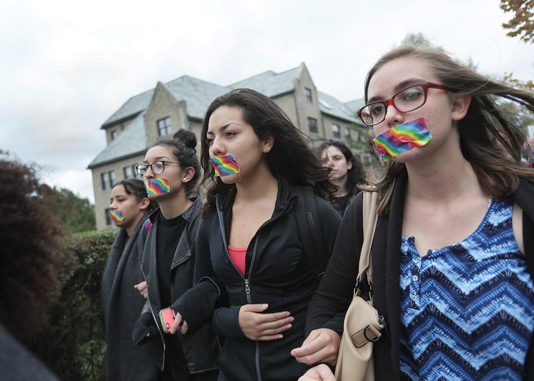 Boston College students marched along Commonwealth Avenue in Newton, Mass., on Sept. 29, 2016, as part of a protest on campus after the administration's non-response to anti-LGBT vandalization. 