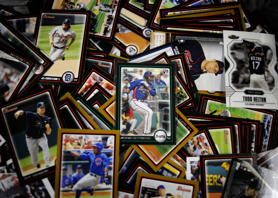 An array of baseball cards spread out on a table