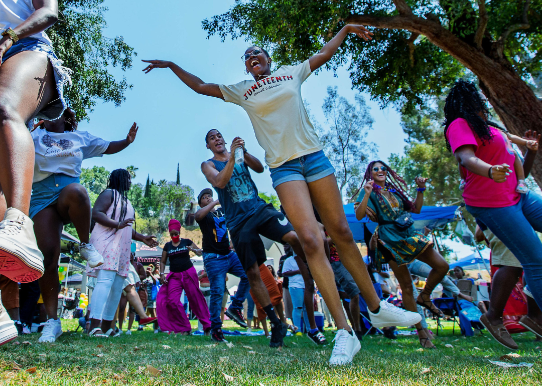 Young people celebrate at a Juneteenth celebration at a park in Riverside, California