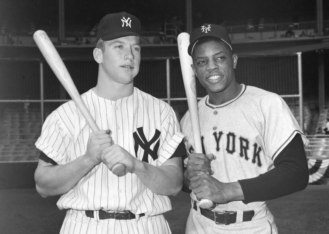 Mickey Mantle of the New York Yankees (L), poses with Willie Mays of the New York Giants (R) at Yankee Stadium prior to the World Series.