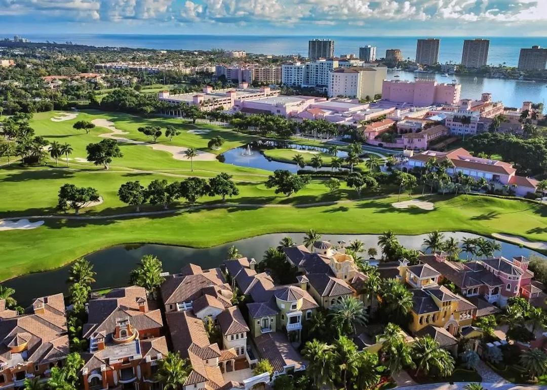 View of a large houses, golf courses, and high rises in Boca Raton, Florida.