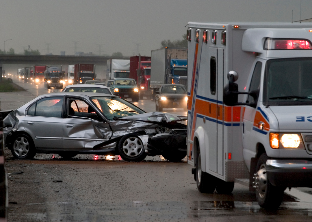 Ambulance blocks traffic after a car accident on an interstate.