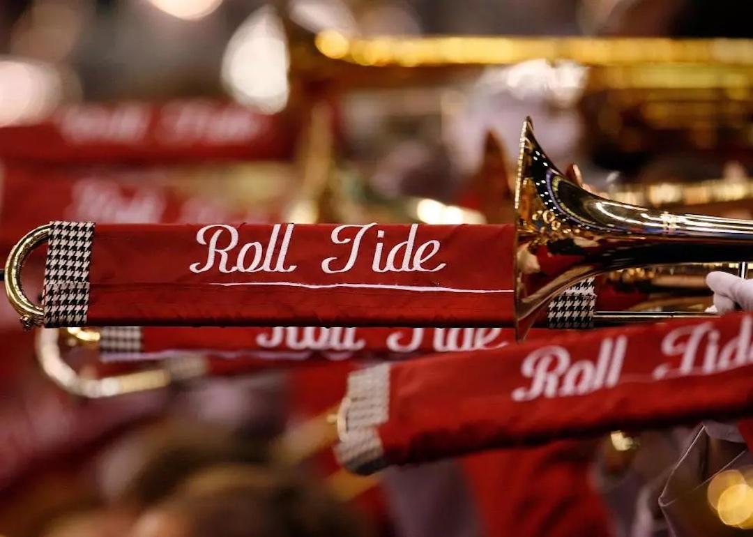 Band instruments with banners that read "Roll Tide."