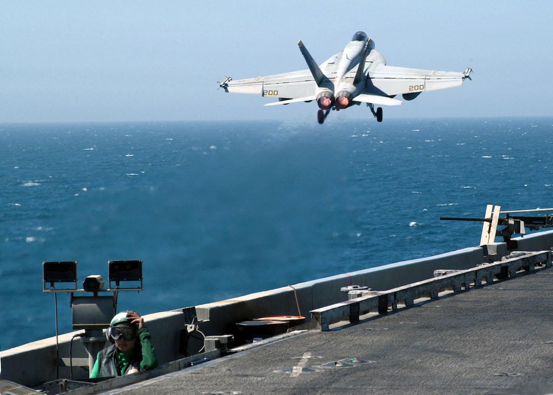 An F/A-18E Super Hornet launches from one of four steam powered catapults on the flight deck aboard USS Abraham Lincoln in 2003.