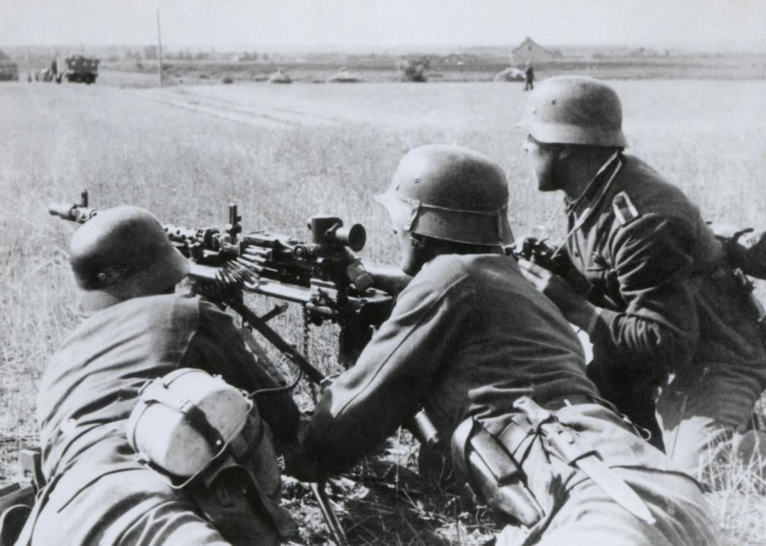 German soldiers fire a machine gun during the Nazi invasion of the Soviet Union (Russia) in the summer of 1941, during World War 2.