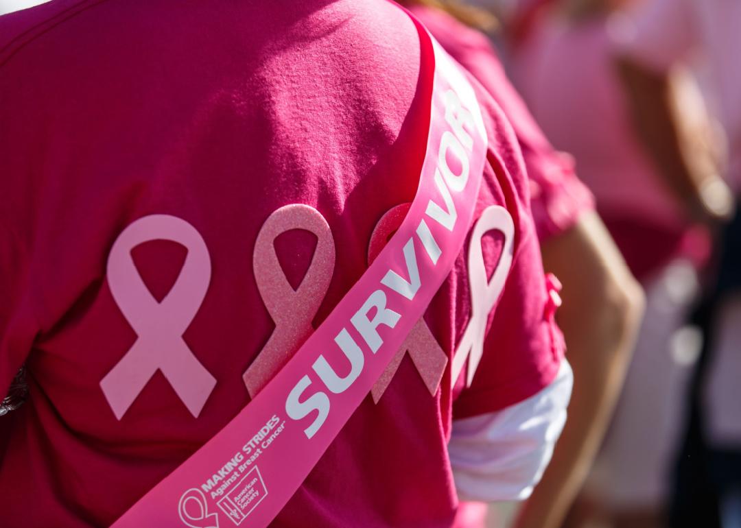 Participant of Making Strides event wearing survivor sash in Ocean City, MD.
