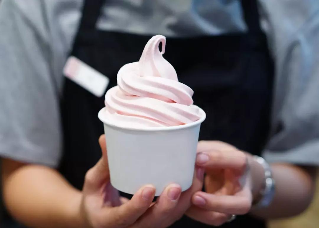 Strawberry soft-serve ice cream in a cup