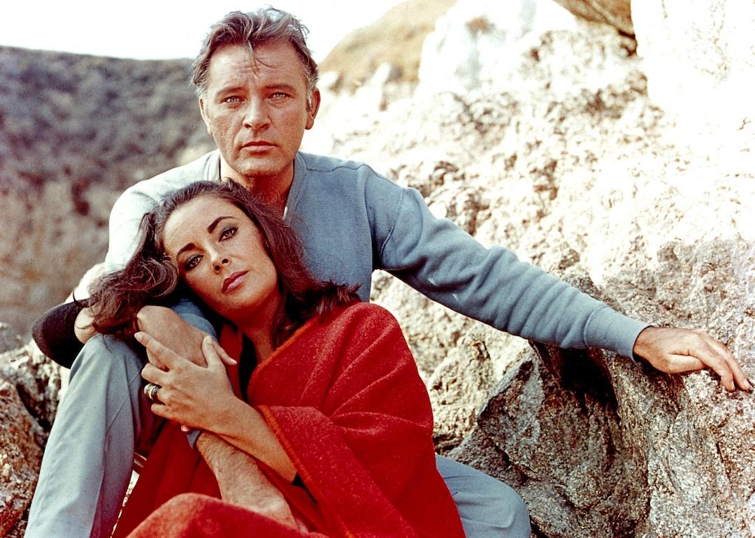 Elizabeth Taylor and Richard Burton on the film set of "The Sandpiper" in 1965.
