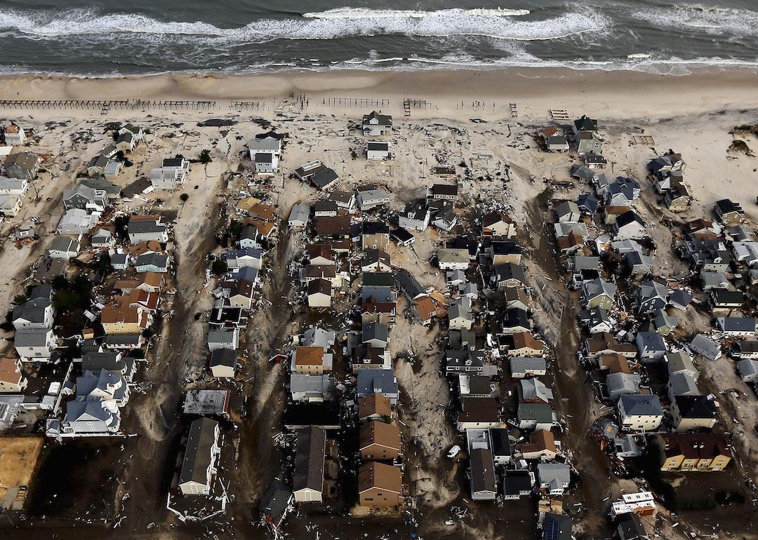 Homes sit in ruin next to the Atlantic Ocean after being destroyed by Hurricane Sandy on October 31, 2012 in Seaside Heights, New Jersey.