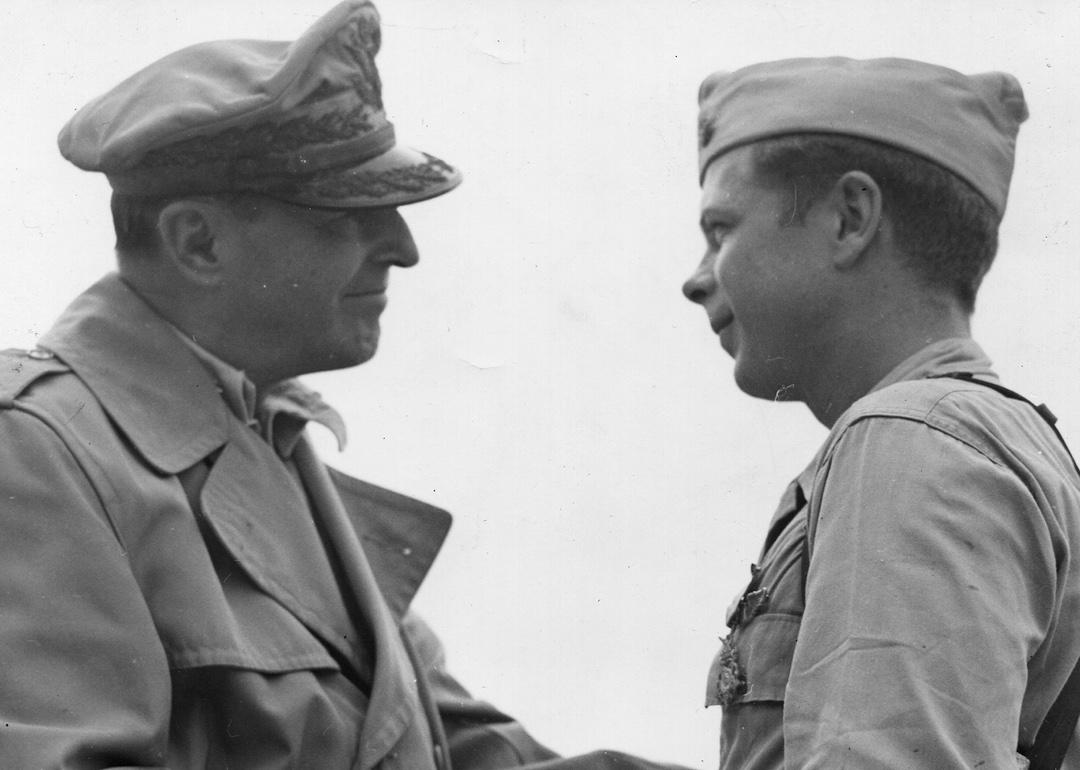 Major Richard Bong shakes hands with General Douglas MacArthur after receiving the Medal of Honor, December 1944.
