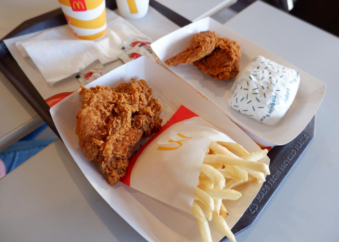 Crispy chicken wings and crispy chicken breast with french fries from McDonalds