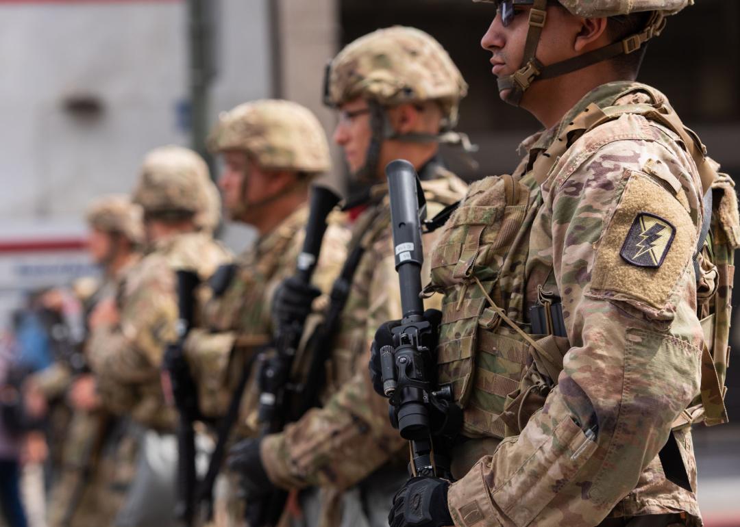 National Guard troops stand along the street during the march against police violence over death of George Floyd.