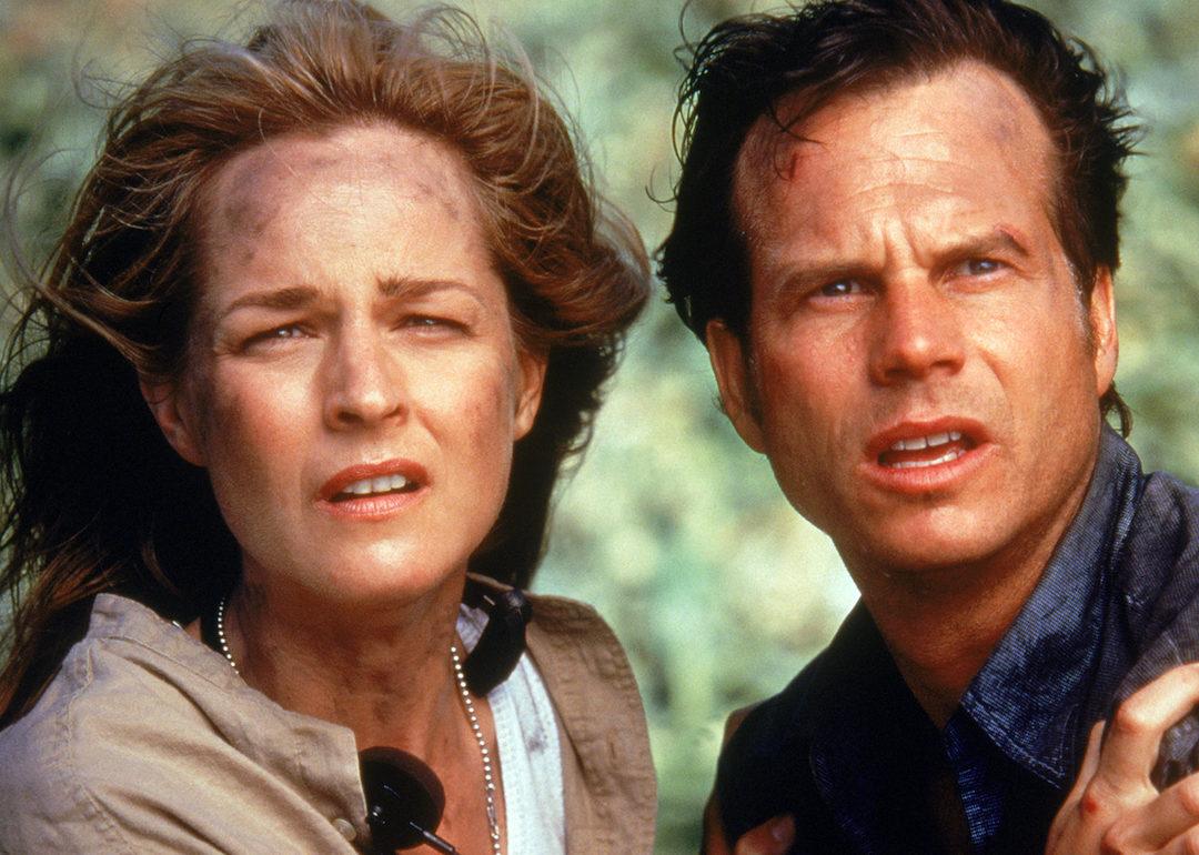 Helen Hunt and Bill Paxton stare down a tornado in the movie "Twister"