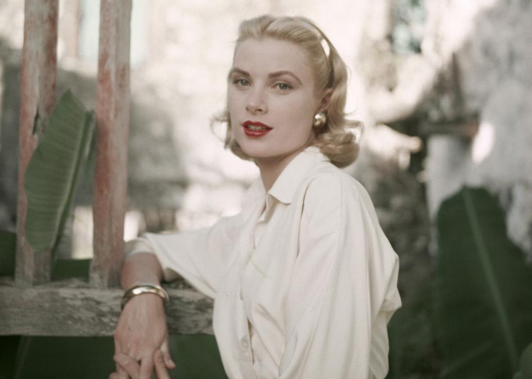 American actor Grace Kelly in a white button-down shirt circa 1955.