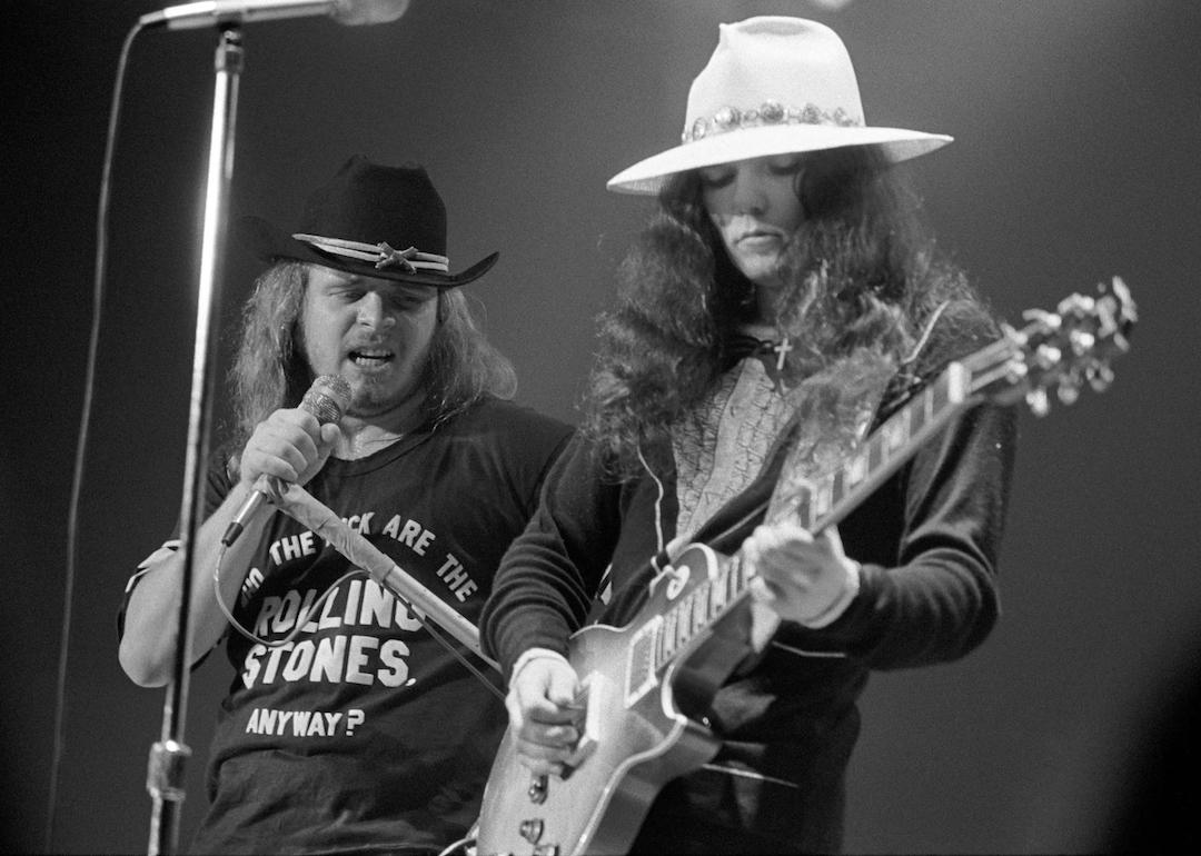 Lynyrd Skynyrd frontman Ronnie Van Zant and guitarist Gary Rossington of Lynyrd Skynyrd perform at the Omni Coliseum on July 5, 1975 in Atlanta, Georgia. 