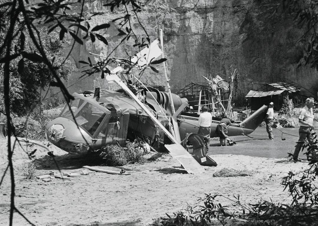Crew begin to disassemble the helicopter that crashed and killed veteran actor Vic Morrow and two child actors on the set of "The Twilight Zone"