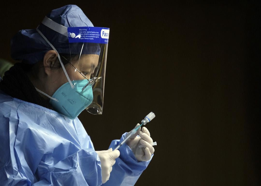  A medical worker prepares a dose of a nasal COVID-19 vaccine at a vaccination site on Dec. 19, 2022 in Beijing, China.