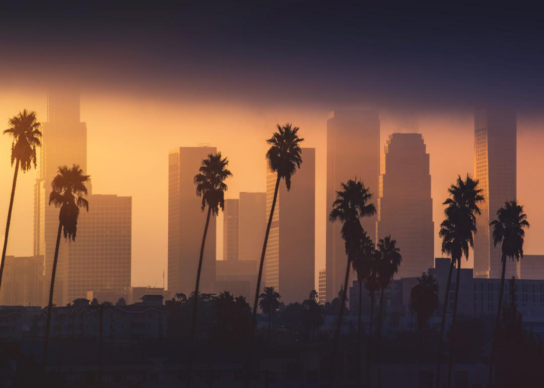 Downtown Los Angeles skyline in foggy morning sunlight.