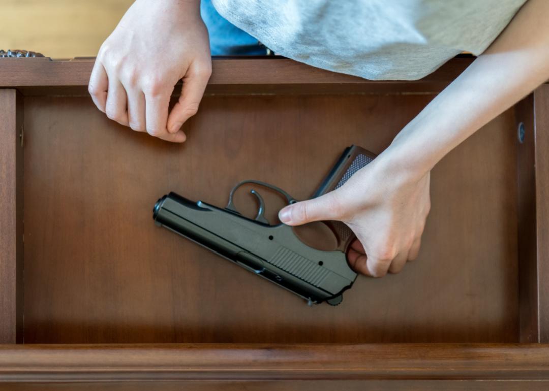 Young person finds gun in drawer.