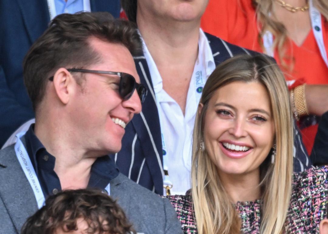 Nick Candy and Holly Valance laugh as they attend Day Four of Wimbledon 2022 at the All England Lawn Tennis and Croquet Club on June 30, 2022 in London, England.