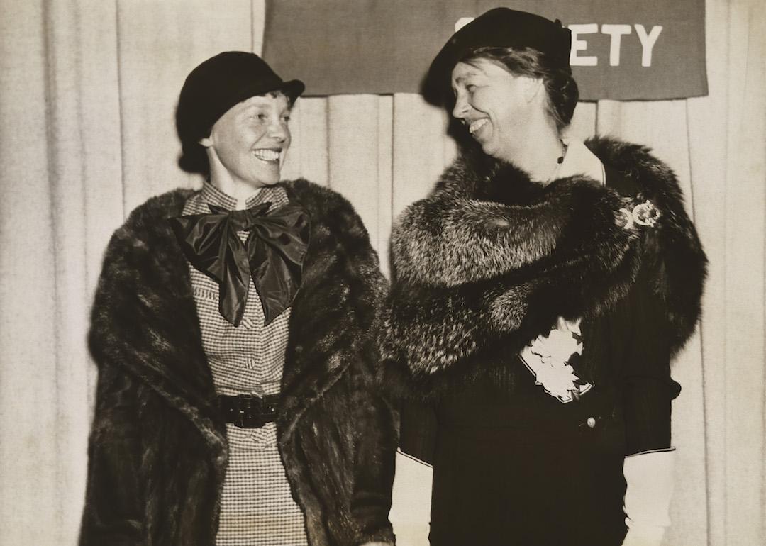 Amelia Earhart and First Lady Eleanor Roosevelt smile at each other on March 2, 1935.