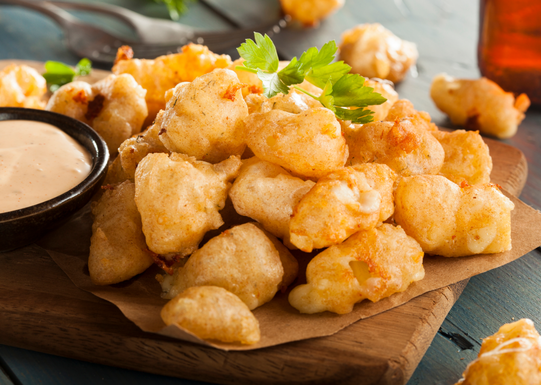 Closeup of Wisconsin cheese curds with dipping sauce.