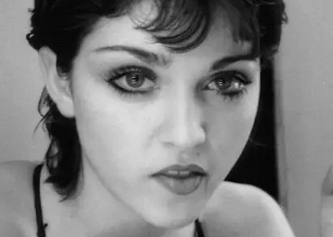 In 1979, Madonna stares in a dressing room mirror in New York City after moving there to study dance.