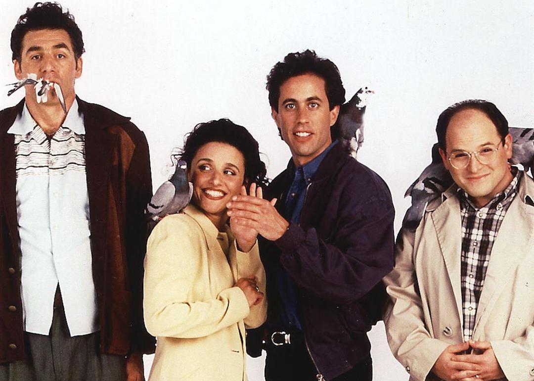 Actors Michael Richards, Julia Louis-Dreyfus, Jerry Seinfeld, and Jason Alexander pose for a promotional photo for 'Seinfeld' with pigeons.
