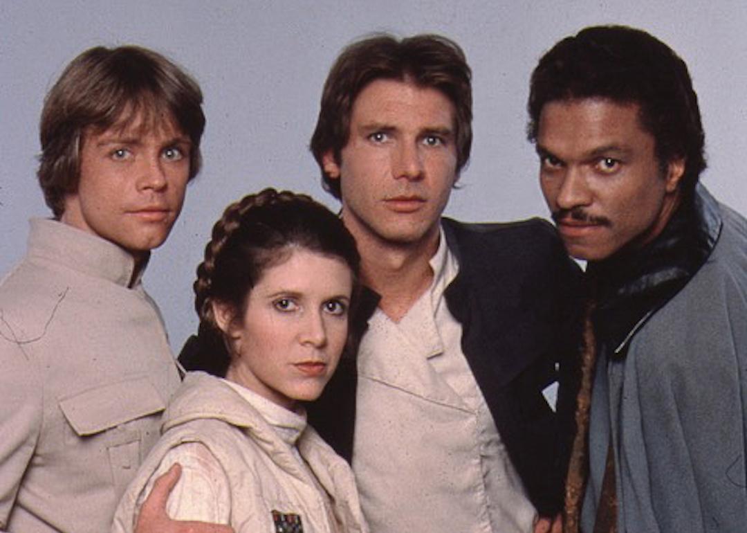 Actors Mark Hamill, Carrie Fisher, Harrison Ford, and Billy Dee Williams pose for a portrait on the set of 'Star Wars: The Empire Strikes Back' in 1979 in London, England.