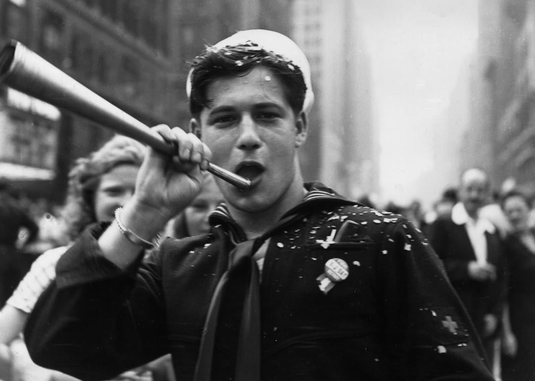 A sailor blows a horn during the VJ Day celebrations in Times Square, New York on Aug. 14, 1945.
