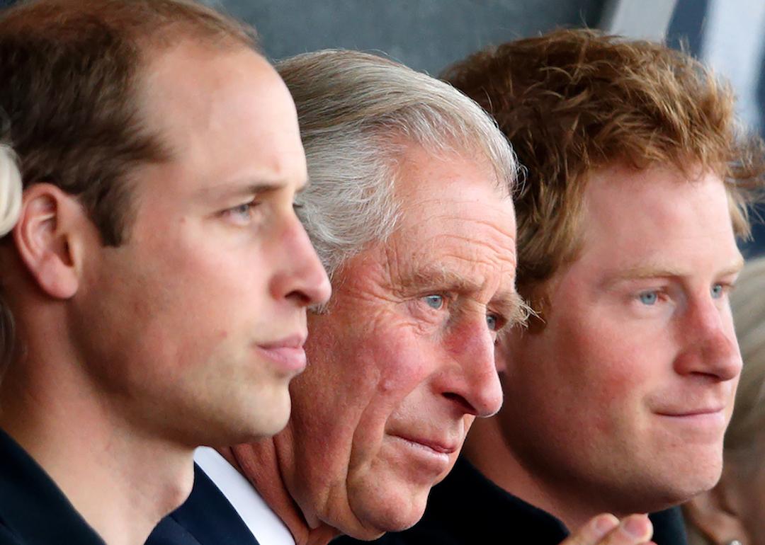 Prince William, King Charles, and Prince Harry watch the athletics during the Invictus Games at the Lee Valley Athletics Centre in 2014 in London, England.