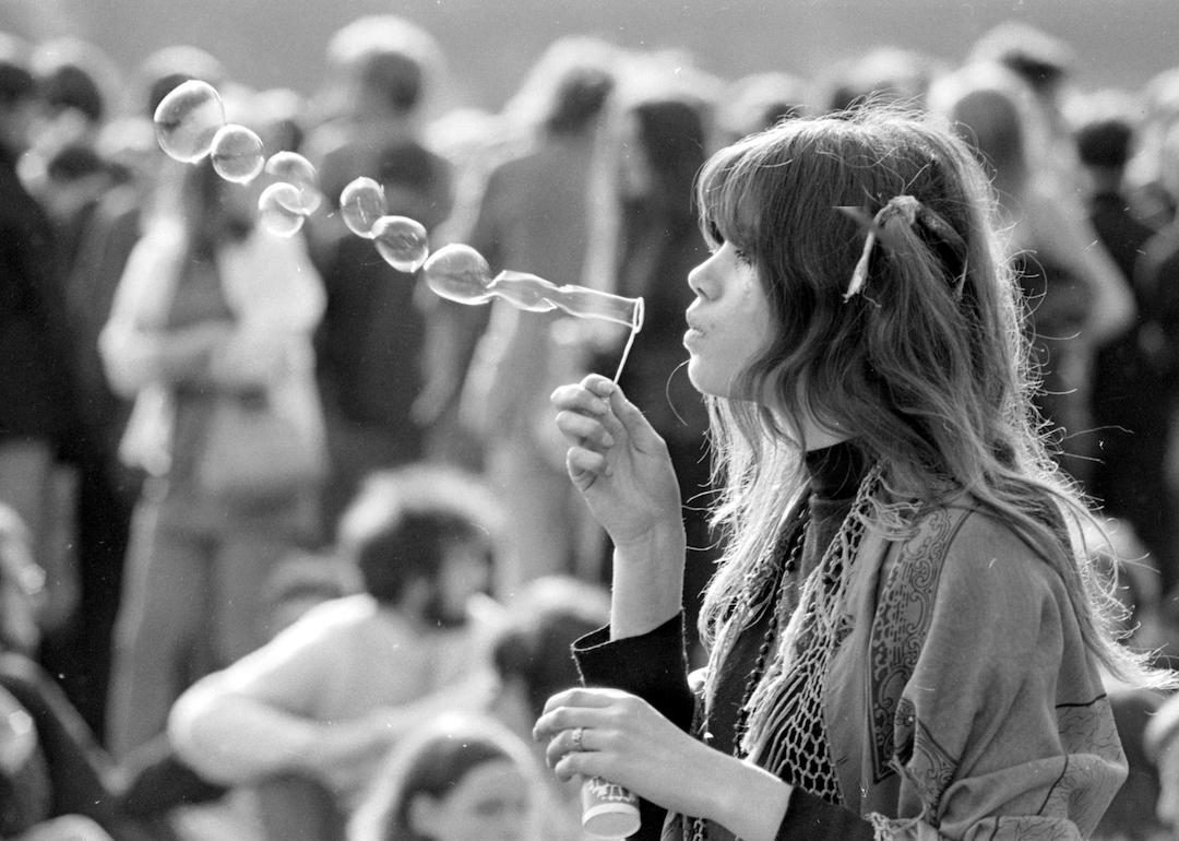 A hippy blowing bubbles at a pop concert in Hyde park, London in June 1969.